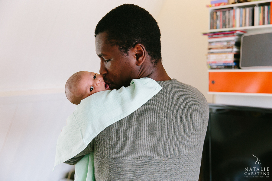 father kissing his newborn baby boy | Photographer: Natalie Carstens, nataliecarstens.com